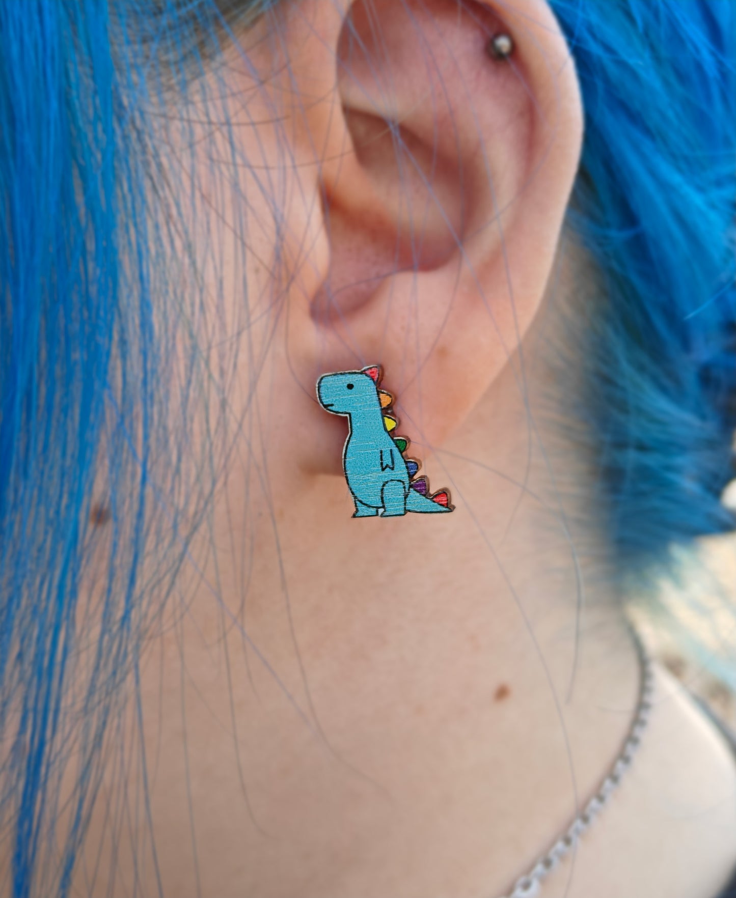 T-rex stud earrings rainbow